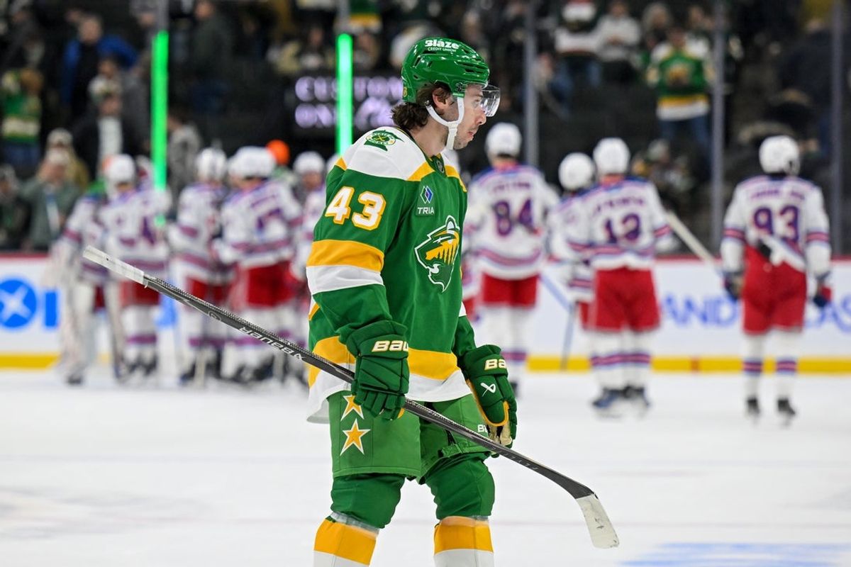 Mar 14, 2026; Saint Paul, Minnesota, USA;  Minnesota Wild defensemen Quinn Hughes (43) leaves the ice as the New York Rangers celebrate their victory at Grand Casino Arena. Mandatory Credit: Nick Wosika-Imagn Images
