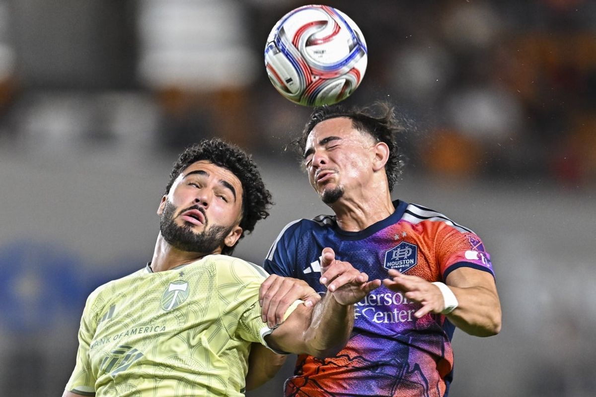 Mar 14, 2026; Houston, Texas, USA; Portland Timbers forward Gage Guerra (88) and Houston Dynamo defender Felipe Andrade (36) leap in attempt to head the ball during the first half at Shell Energy Stadium. Mandatory Credit: Maria Lysaker-Imagn Images