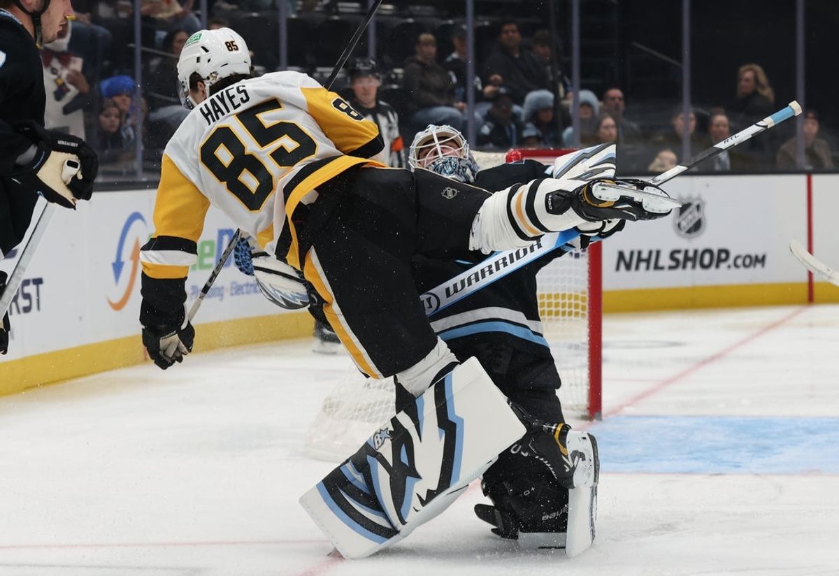 Mar 14, 2026; Salt Lake City, Utah, USA; Pittsburgh Penguins right wing Avery Hayes (85) and Utah Mammoth goaltender Karel Vejmelka (70) collide on a play during the first period at Delta Center. Mandatory Credit: Rob Gray-Imagn Images