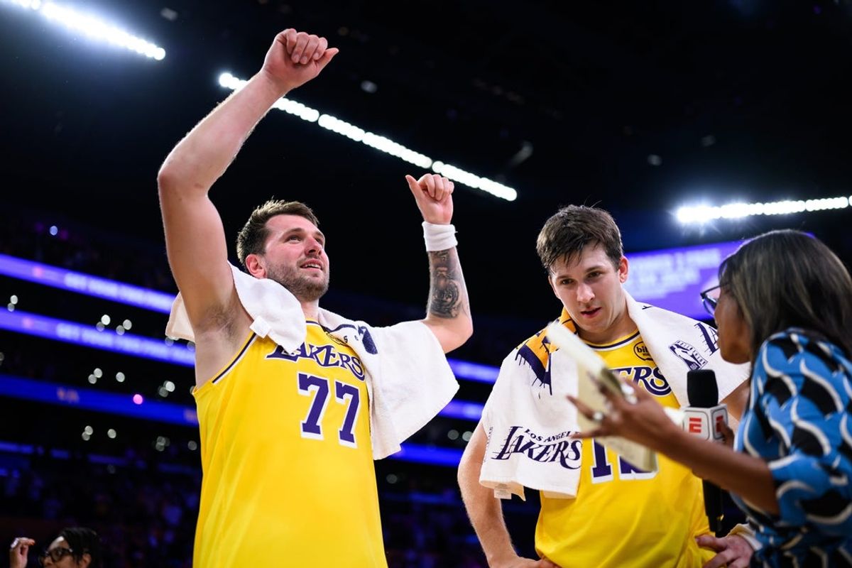 Mar 14, 2026; Los Angeles, California, USA; Los Angeles Lakers guard Luka Doncic (77) gestures after scoring a game winning shot during overtime against the Denver Nuggets at Crypto.com Arena. Mandatory Credit: William Liang-Imagn Images
