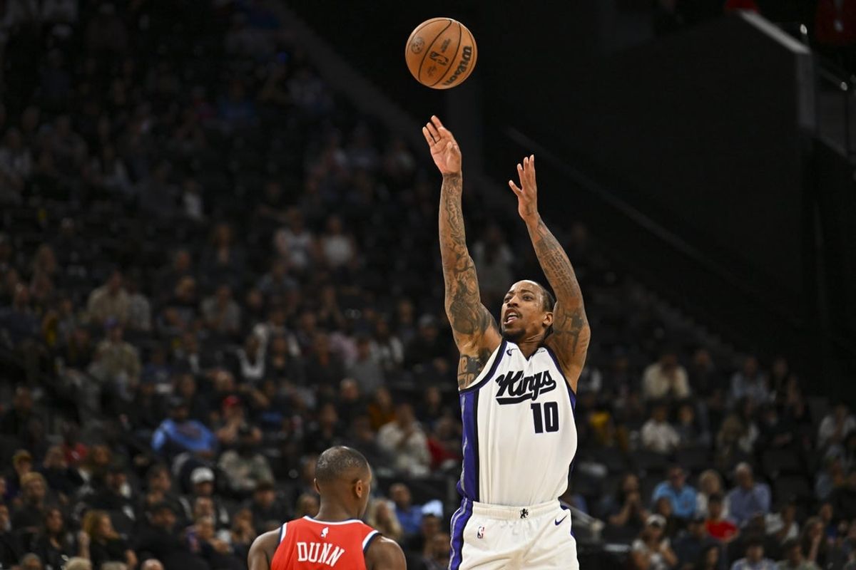 Mar 14, 2026; Inglewood, California, USA; Sacramento Kings guard-forward DeMar DeRozan (10) shoots against LA Clippers guard Kris Dunn (8) during the second half at Intuit Dome. Mandatory Credit: Jonathan Hui-Imagn Images