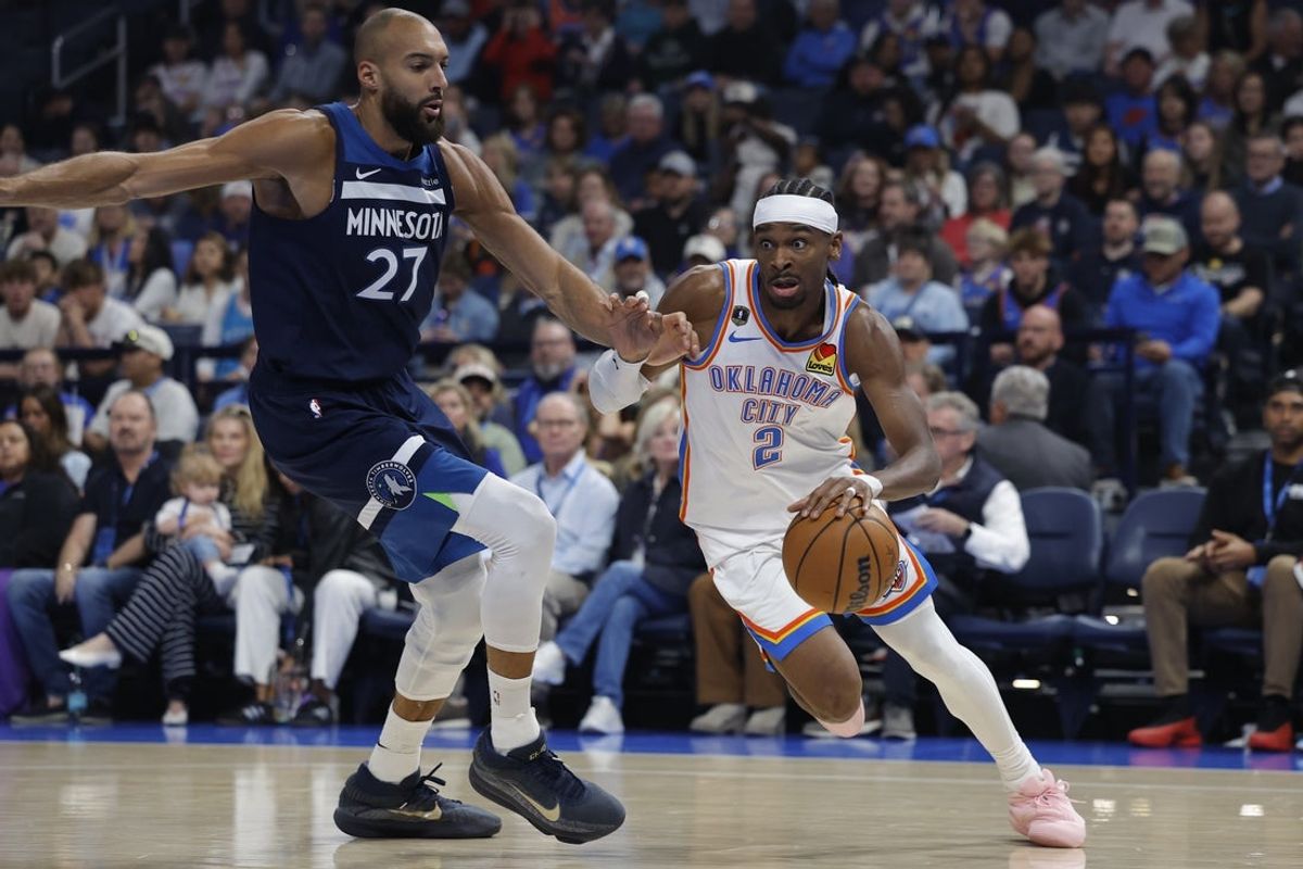 Mar 15, 2026; Oklahoma City, Oklahoma, USA; Oklahoma City Thunder guard Shai Gilgeous-Alexander (2) drives around Minnesota Timberwolves center Rudy Gobert (27) during the first half at Paycom Center. Mandatory Credit: Alonzo Adams-Imagn Images