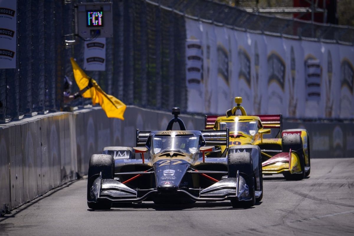 Mar 15, 2026; Arlington, Texas, USA; Andretti Global driver Kyle Kirkwood (27) crosses the finish line ahead of Chip Ganassi Racing driver Alex Palou (10) to win the 2026 IndyCar at Streets of Arlington under yellow caution. Mandatory Credit: Jerome Miron-Imagn Images