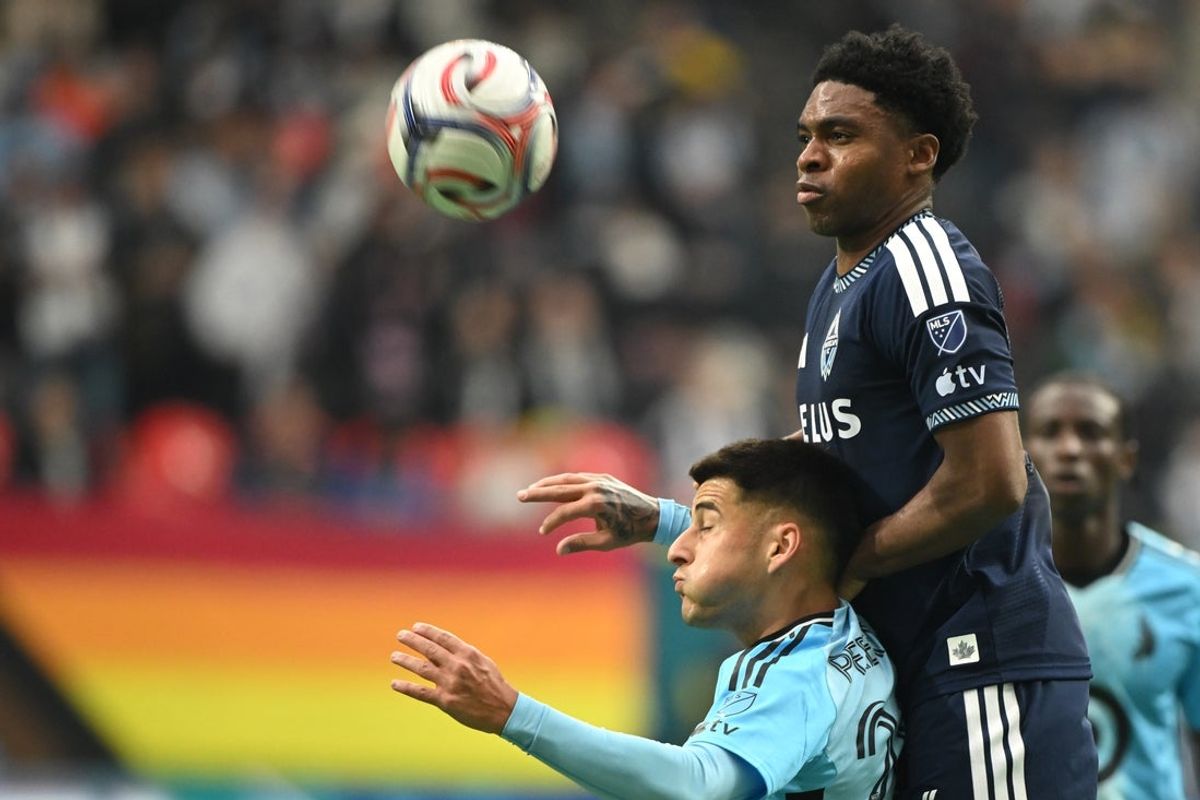Mar 15, 2026; Vancouver, British Columbia, CAN;  Vancouver Whitecaps FC midfielder Ralph Priso (6) heads the ball against Minnesota United fC midfielder Joaquín Pereyra (26) during the first half at BC Place. Mandatory Credit: Anne-Marie Sorvin-Imagn Images