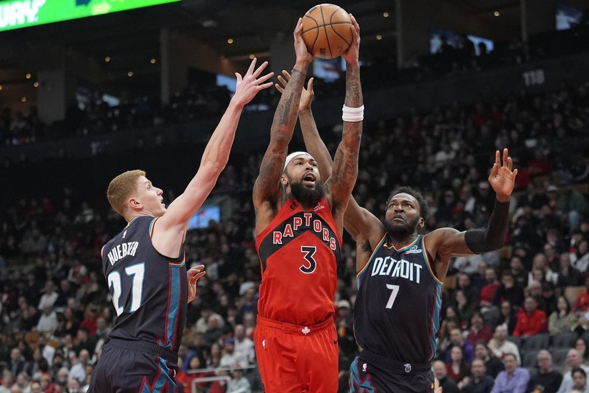 Mar 15, 2026; Toronto, Ontario, CAN; Toronto Raptors forward Brandon Ingram (3) goes up to make a basket against Detroit Pistons guard Kevin Huerter (27) and center Paul Reed (7) during the second half at Scotiabank Arena. Mandatory Credit: John E. Sokolowski-Imagn Images