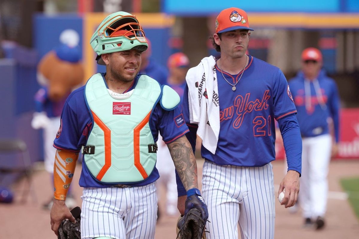 Mar 15, 2026; Port St. Lucie, Florida, USA;  New York Mets starting pitcher Zach Thornton (21) and catcher Francisco Alvarez (4) walk in from the bullpen before the game against the Toronto Blue Jays at Clover Park. Mandatory Credit: Jim Rassol-Imagn Images