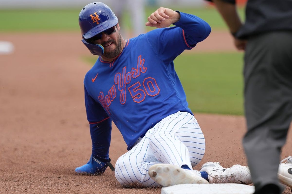 Mar 15, 2026; Port St. Lucie, Florida, USA;  New York Mets right fielder Mike Tauchman (50) goes from first to third base on a hit by shortstop Francisco Lindor (12) against the Toronto Blue Jays at Clover Park. Mandatory Credit: Jim Rassol-Imagn Images