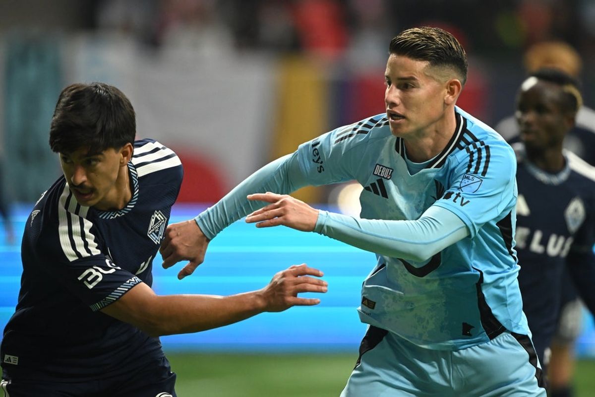 Mar 15, 2026; Vancouver, British Columbia, CAN;  Vancouver Whitecaps FC defender Mathías Laborda (2) defends against Minnesota United fC midfielder James Rodriguez (10) during the second half  during the second half at BC Place. Mandatory Credit: Anne-Marie Sorvin-Imagn Images