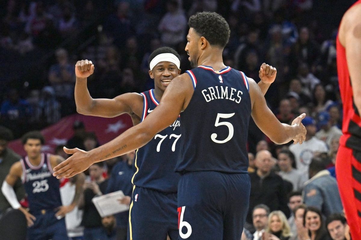 Mar 15, 2026; Philadelphia, Pennsylvania, USA; Philadelphia 76ers guard Vj Edgecombe (77) and guard Quentin Grimes (5) celebrate win against the Portland Trail Blazers during the second half at Xfinity Mobile Arena. Mandatory Credit: Eric Hartline-Imagn Images