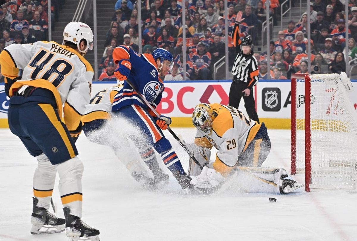 Mar 15, 2026; Edmonton, Alberta, CAN; Edmonton Oilers center Connor McDavid (97) goes for a shot on Nashville Predators goalie Justus Annunen (29) during the first period at Rogers Place. Mandatory Credit: Walter Tychnowicz-Imagn Images