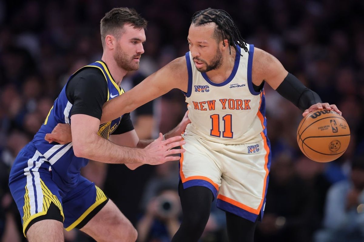 Mar 15, 2026; New York, New York, USA; New York Knicks guard Jalen Brunson (11) controls the ball against Golden State Warriors guard Pat Spencer (61) during the first quarter at Madison Square Garden. Mandatory Credit: Brad Penner-Imagn Images
