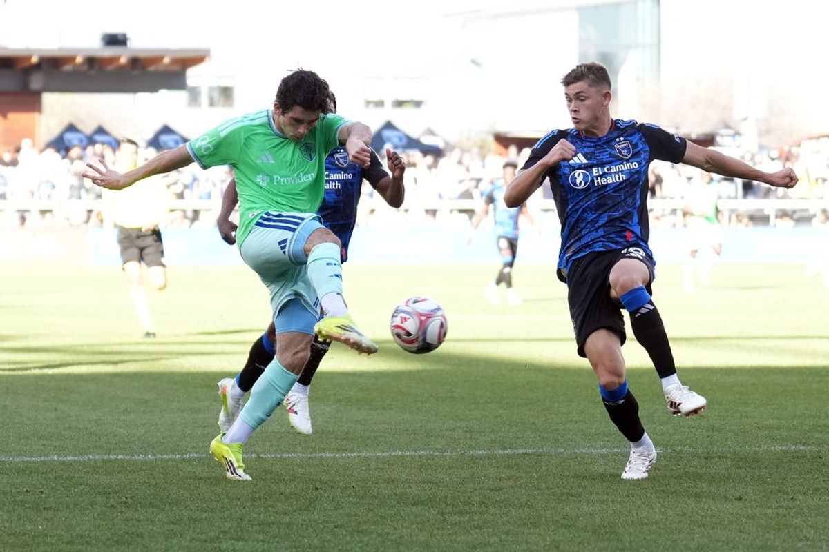 Mar 15, 2026; San Jose, California, USA; Seattle Sounders midfielder Paul Rothrock (left) shoots against San Jose Earthquakes defender Reid Roberts (right) during the second half at PayPal Park. Mandatory Credit: Darren Yamashita-Imagn Images