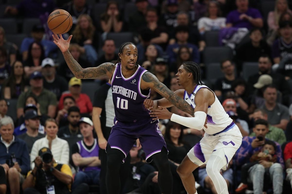 Mar 15, 2026; Sacramento, California, USA; Sacramento Kings guard-forward DeMar DeRozan (10) catches the ball while being defended by Utah Jazz forward Cody Williams (5) during the fourth quarter at Golden 1 Center. Mandatory Credit: Dennis Lee-Imagn Images