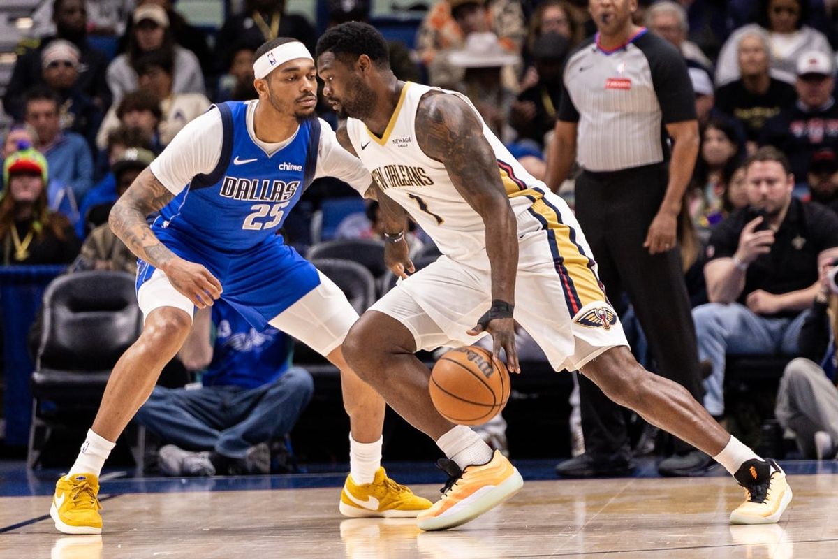 Mar 16, 2026; New Orleans, Louisiana, USA;  New Orleans Pelicans forward Zion Williamson (1) dribbles against Dallas Mavericks forward P.J. Washington (25) during the first half at Smoothie King Center. Mandatory Credit: Stephen Lew-Imagn Images