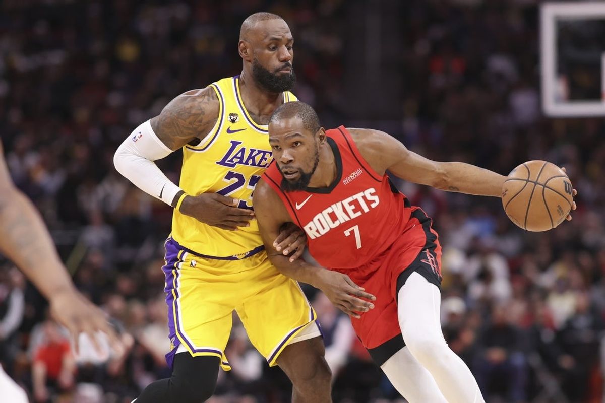 Mar 16, 2026; Houston, Texas, USA; Houston Rockets forward Kevin Durant (7) dribbles the ball as Los Angeles Lakers forward LeBron James (23) defends during the first quarter at Toyota Center. Mandatory Credit: Troy Taormina-Imagn Images