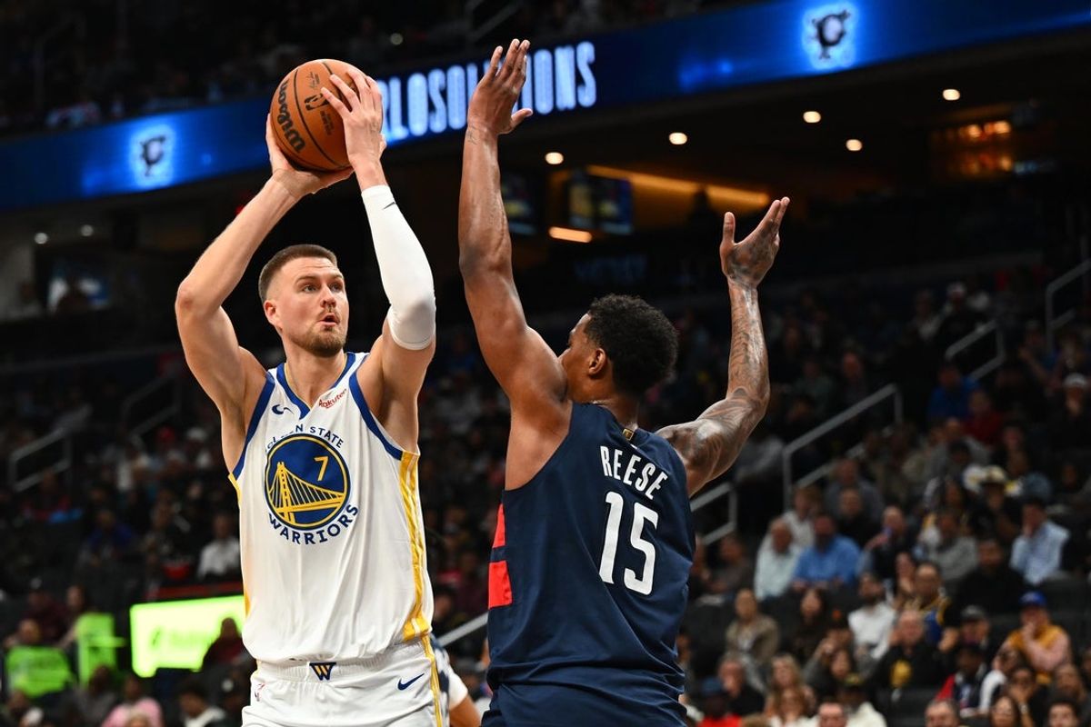 Mar 16, 2026; Washington, District of Columbia, USA; Golden State Warriors center Kristaps Porzingis (7) looks to shoot over Washington Wizards forward Julian Reese (15) during the second half at Capital One Arena. Mandatory Credit: Brad Mills-Imagn Images