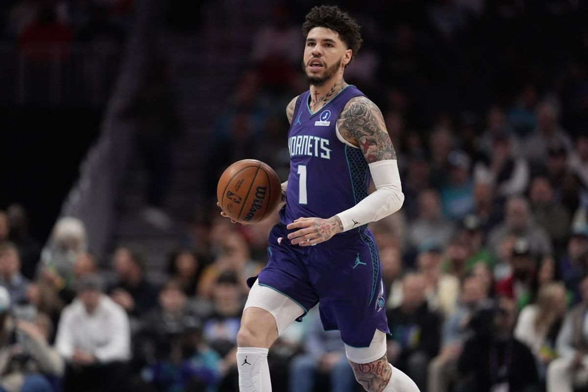 Mar 17, 2026; Charlotte, North Carolina, USA; Charlotte Hornets guard LaMelo Ball (1) brings the ball up court against the Miami Heat during the first quarter at Spectrum Center. Mandatory Credit: Jim Dedmon-Imagn Images