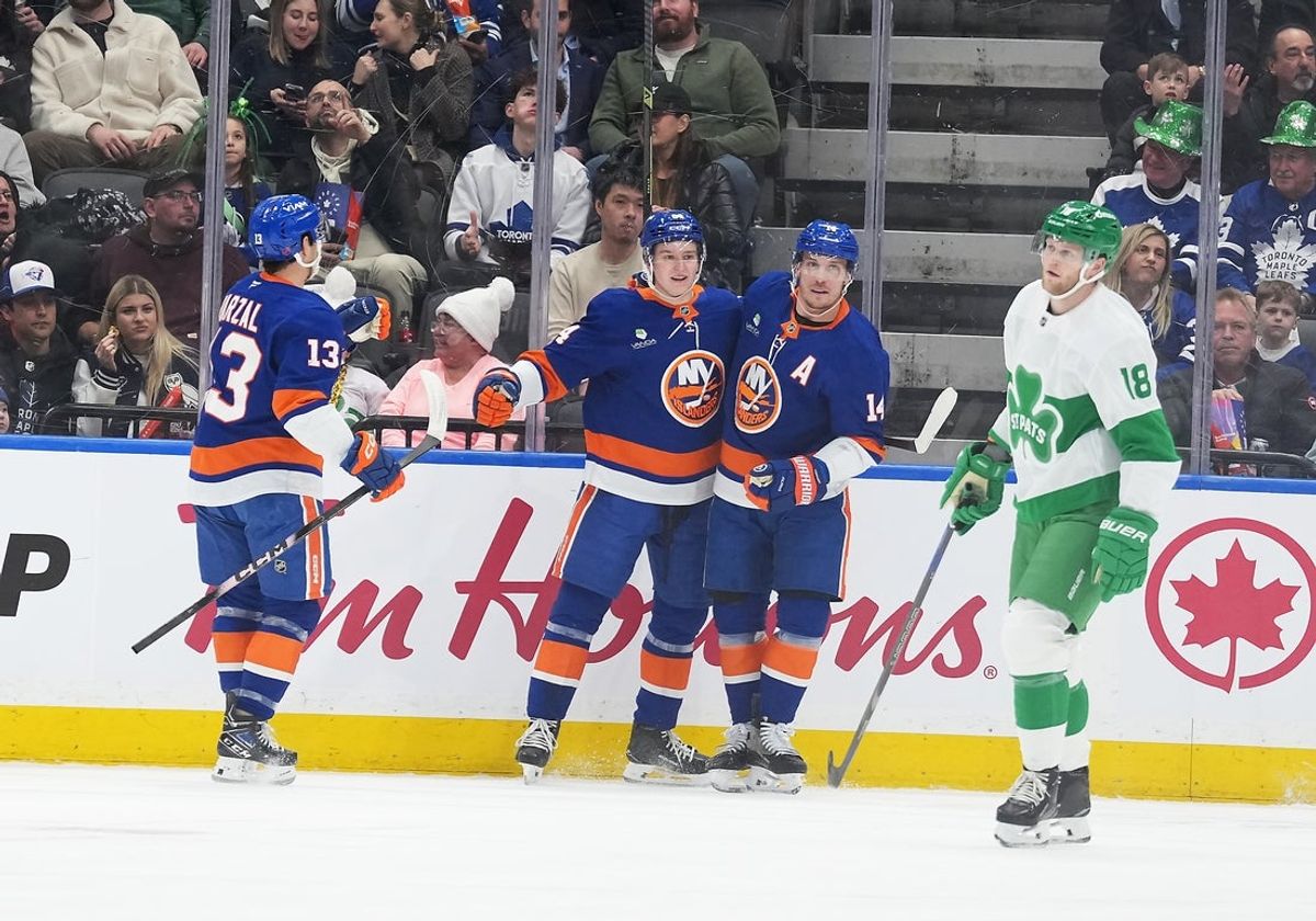 Mar 17, 2026; Toronto, Ontario, CAN; New York Islanders center Calum Ritchie (64) scores a goal and celebrates with center Bo Horvat (14) against the Toronto Maple Leafs during the first period at Scotiabank Arena. Mandatory Credit: Nick Turchiaro-Imagn Images