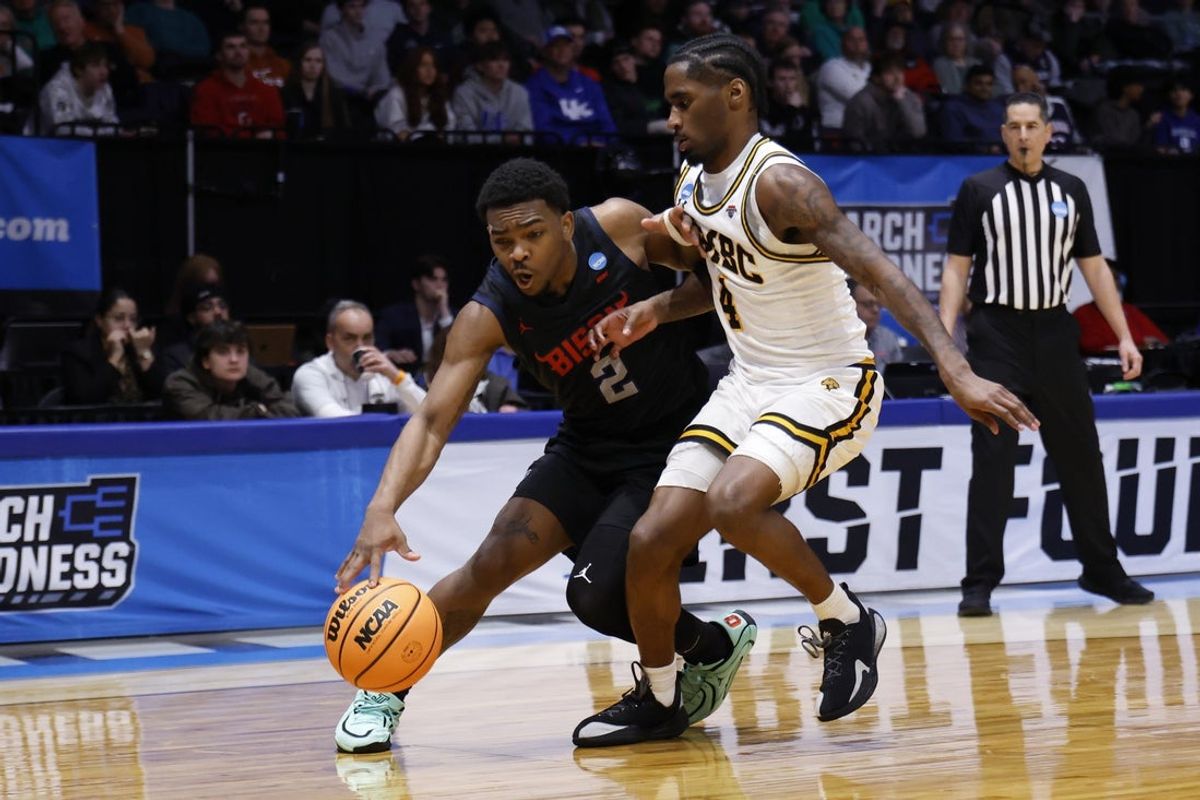 Mar 17, 2026; Dayton, OH, USA; Howard Bison guard Cam Gillus (2) dribbles defended by UMBC Retrievers guard Jah'likai King (4) in the second half during a first four game of the men's 2026 NCAA Tournament at University of Dayton Arena. Mandatory Credit: Rick Osentoski-Imagn Images