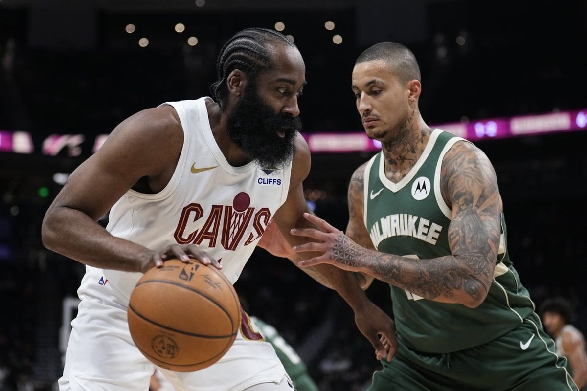 Mar 17, 2026; Milwaukee, Wisconsin, USA;  Cleveland Cavaliers guard James Harden (1) drives against Milwaukee Bucks forward Kyle Kuzma (18) in the first half at Fiserv Forum. Mandatory Credit: Michael McLoone-Imagn Images