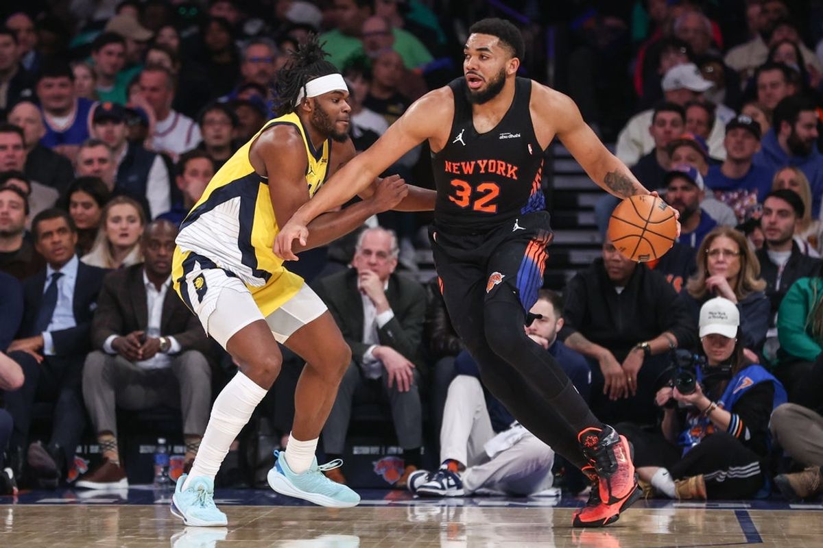 Mar 17, 2026; New York, New York, USA;  New York Knicks center Karl-Anthony Towns (32) looks to drive past Indiana Pacers forward Jarace Walker (5) in the second quarter at Madison Square Garden. Mandatory Credit: Wendell Cruz-Imagn Images