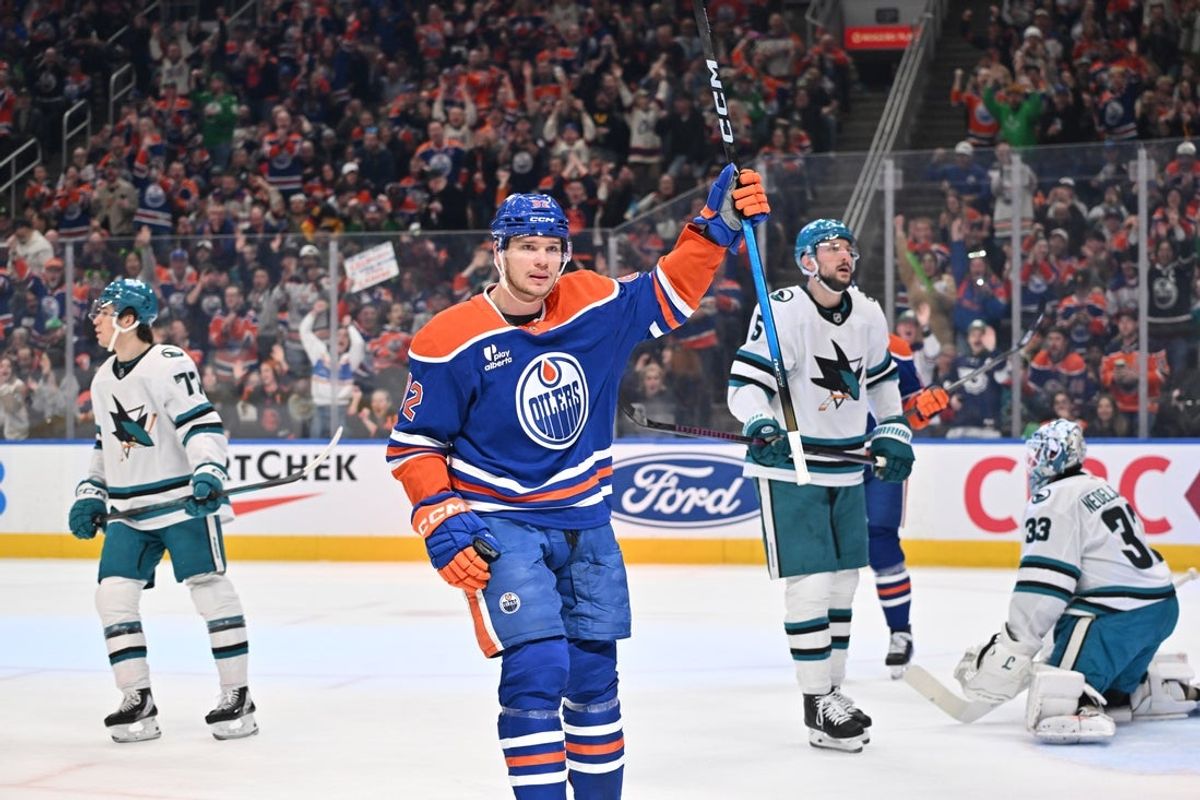 Mar 17, 2026; Edmonton, Alberta, CAN; Edmonton Oilers right winger Vasily Podkolzin (92) celebrates a goal on San Jose Sharks goalie Alex Nedeljkovic (33) during the first period at Rogers Place. Mandatory Credit: Walter Tychnowicz-Imagn Images