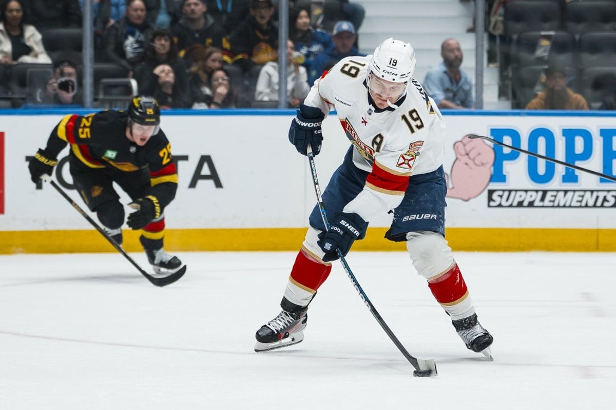 Mar 17, 2026; Vancouver, British Columbia, CAN; Florida Panthers forward Matthew Tkachuk (19) scores on the shot against the Vancouver Canucks in the first period at Rogers Arena. Mandatory Credit: Bob Frid-Imagn Images