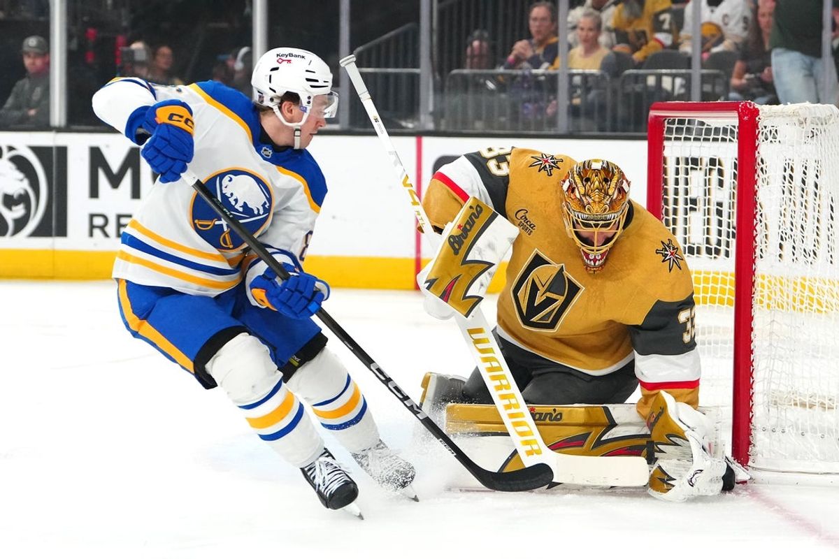 Mar 17, 2026; Las Vegas, Nevada, USA; Vegas Golden Knights goaltender Adin Hill (33) makes a save against Buffalo Sabres center Noah Ostlund (86) during the first period at T-Mobile Arena. Mandatory Credit: Stephen R. Sylvanie-Imagn Images