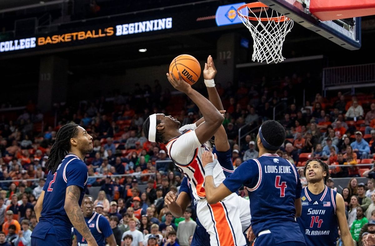 Auburn Tigers forward Sebastian Williams-Adams (33) goes up for a layup as Auburn Tigers take on South Alabama Jaguars during the first round of the National Invitation Tournament at Neville Arena in Auburn, Ala. on Tuesday, March 17, 2026. South Alabama Jaguars leads Auburn Tigers 36-30 at halftime.