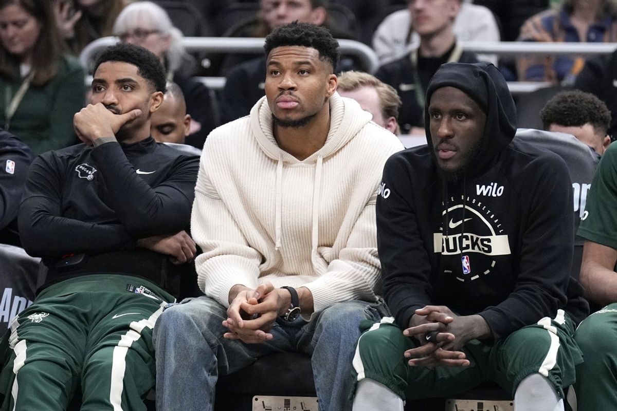 Mar 17, 2026; Milwaukee, Wisconsin, USA; Milwaukee Bucks guard Gary Harris (11), left, Milwaukee Bucks forward Giannis Antetokounmpo (34) and Milwaukee Bucks forward Taurean Prince (12) watch the game against the Cleveland Cavaliers from the bench in the second half at Fiserv Forum. Mandatory Credit: Michael McLoone-Imagn Images