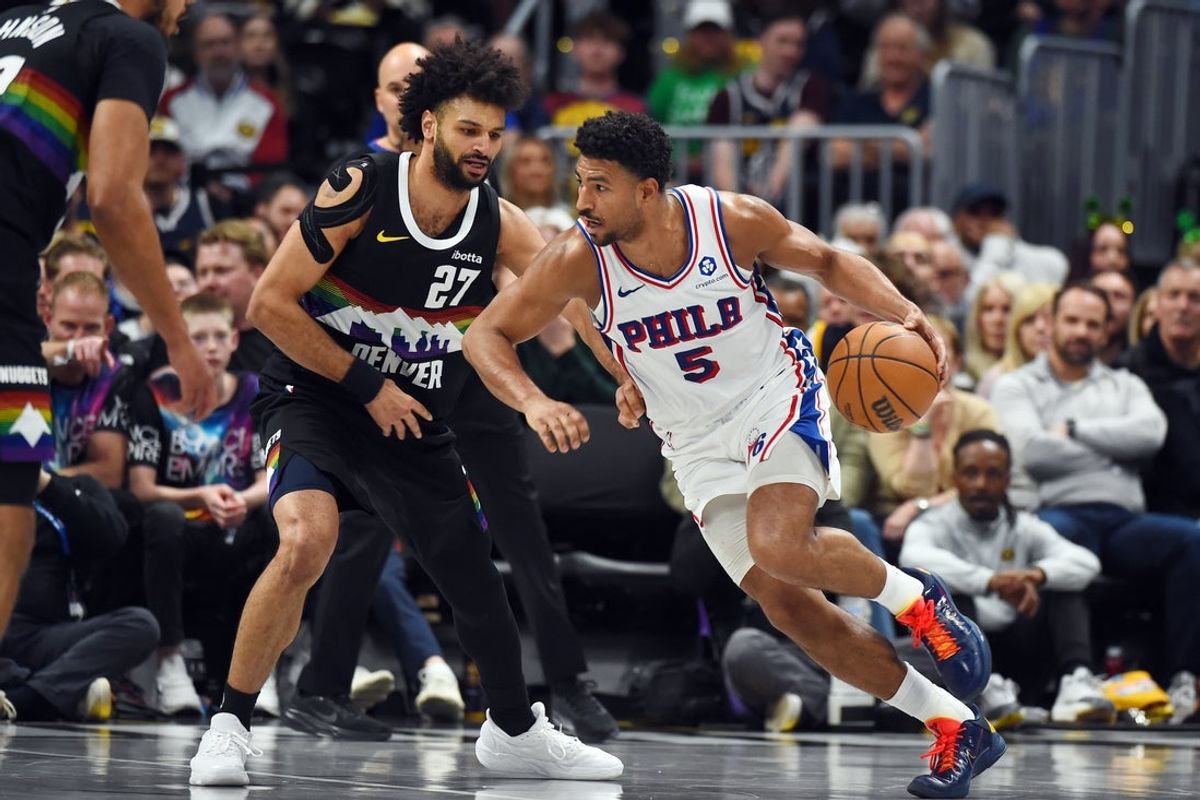Mar 17, 2026; Denver, Colorado, USA; Philadelphia 76ers guard Quentin Grimes (5) handles the ball as he is defended by Denver Nuggets guard Jamal Murray (27) during the first half at Ball Arena. Mandatory Credit: Christopher Hanewinckel-Imagn Images