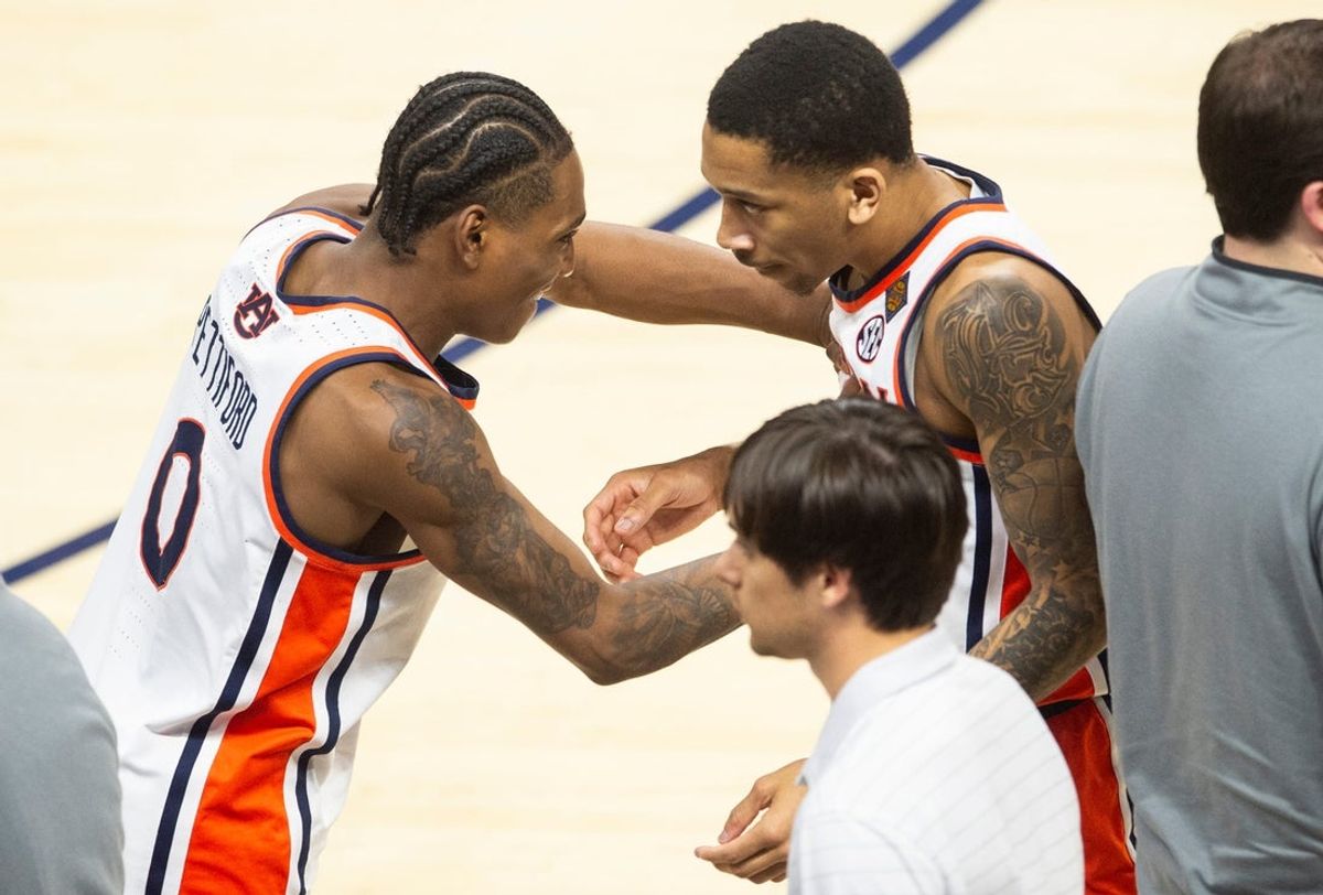 Auburn Tigers guard Tahaad Pettiford (0) celebrates with guard Kaden Magwood (5) as Auburn Tigers take on South Alabama Jaguars during the first round of the National Invitation Tournament at Neville Arena in Auburn, Ala. on Tuesday, March 17, 2026. Auburn Tigers defeated South Alabama Jaguars 78-67.
