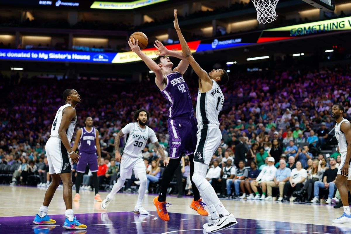 Mar 17, 2026; Sacramento, California, USA; San Antonio Spurs forward Victor Wembanyama (1) blocks a shot by Sacramento Kings center Maxime Raynaud (42) during the third quarter at Golden 1 Center. Mandatory Credit: Sergio Estrada-Imagn Images