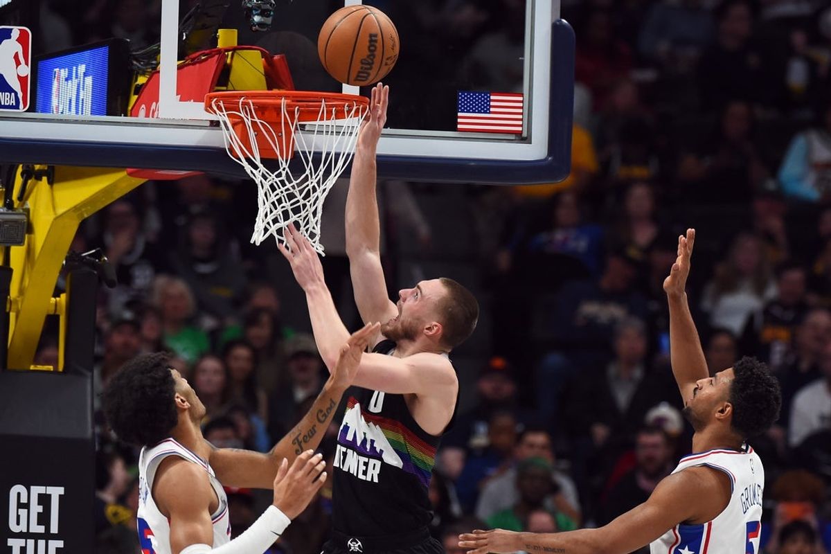 Mar 17, 2026; Denver, Colorado, USA; Denver Nuggets guard Christian Braun (0) scores during the second half against the Philadelphia 76ers at Ball Arena. Mandatory Credit: Christopher Hanewinckel-Imagn Images