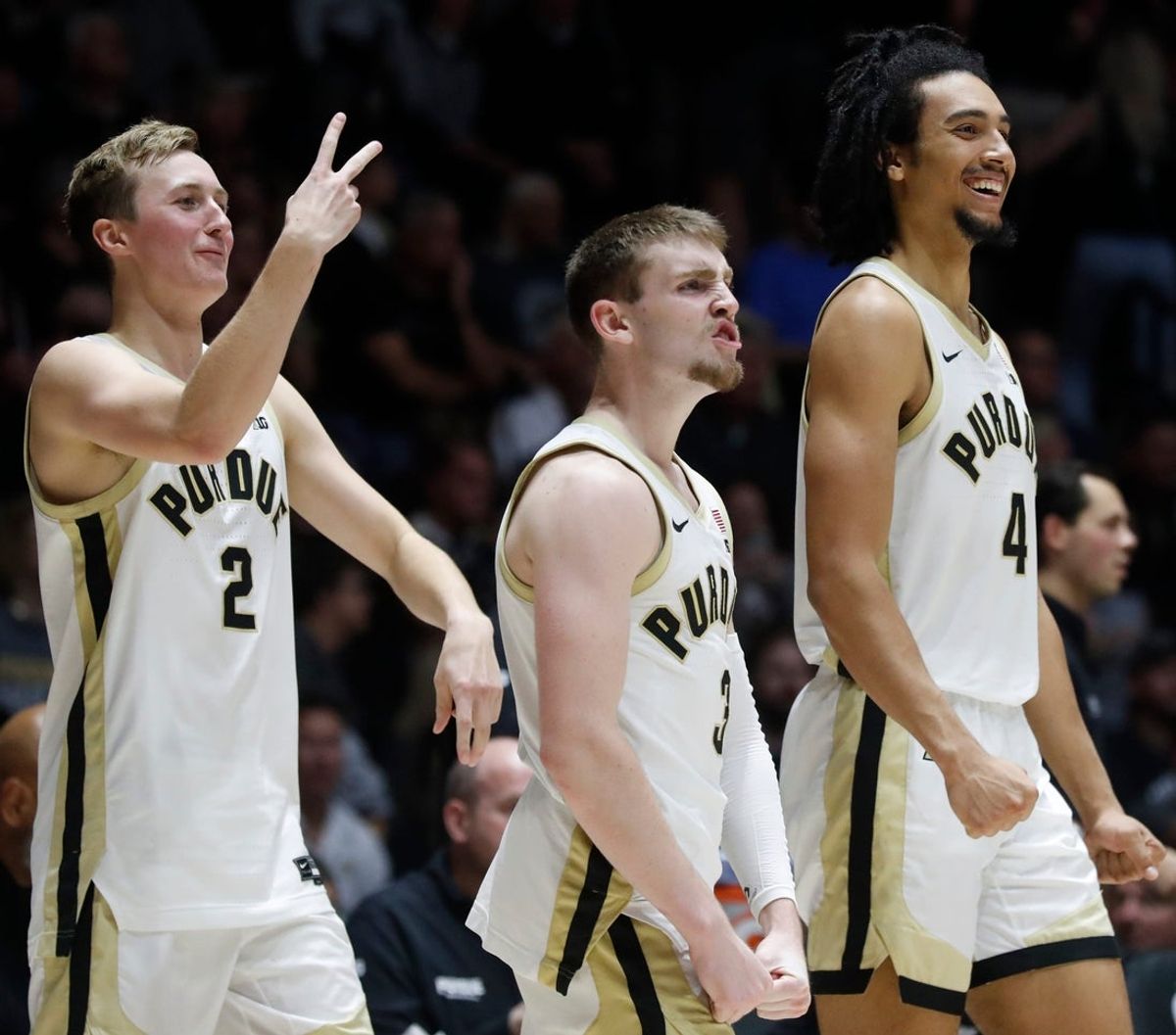 Purdue Boilermakers guard Fletcher Loyer (2), Purdue Boilermakers guard Braden Smith (3) and Purdue Boilermakers forward Trey Kaufman-Renn (4) react to the dunk by Purdue Boilermakers center Will Berg (44) during the NCAA menâ€™s basketball game against the Samford Bulldogs, Monday, Nov. 6, 2023, at Mackey Arena in West Lafayette, Ind. Purdue Boilermakers won 98-45.