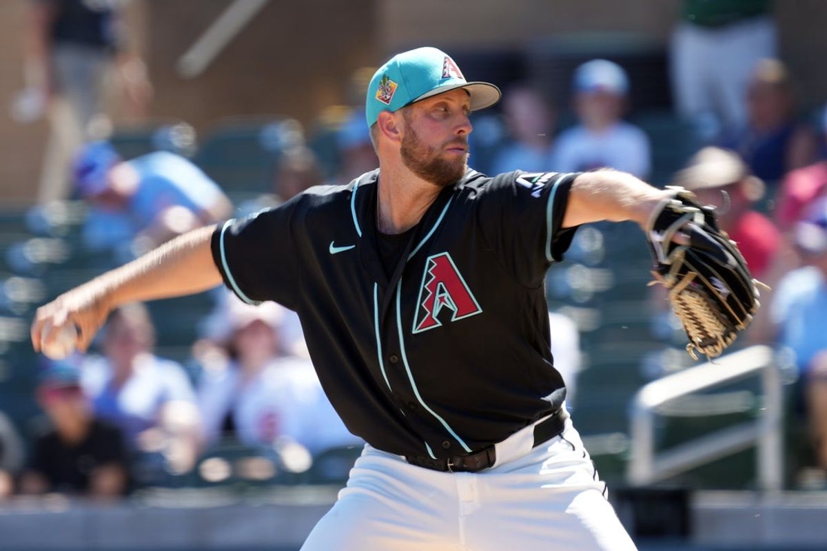 Mar 18, 2026; Salt River Pima-Maricopa, Arizona, USA; Arizona Diamondbacks pitcher Merrill Kelly (29) throws against the Chicago Cubs in the first inning at Salt River Fields at Talking Stick. Mandatory Credit: Rick Scuteri-Imagn Images