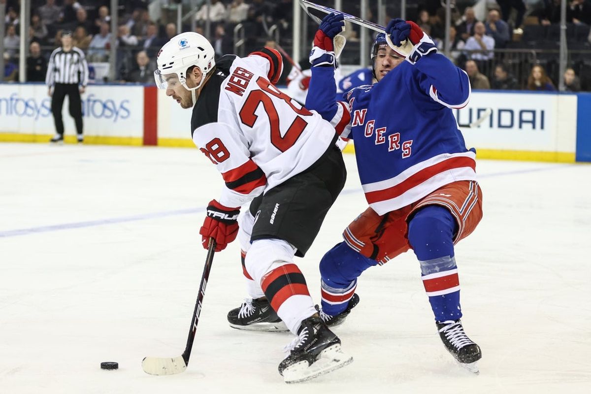 Mar 18, 2026; New York, New York, USA;  New Jersey Devils right wing Timo Meier (28) and New York Rangers center Noah Laba (42) battle for control of the puck in the second period at Madison Square Garden. Mandatory Credit: Wendell Cruz-Imagn Images