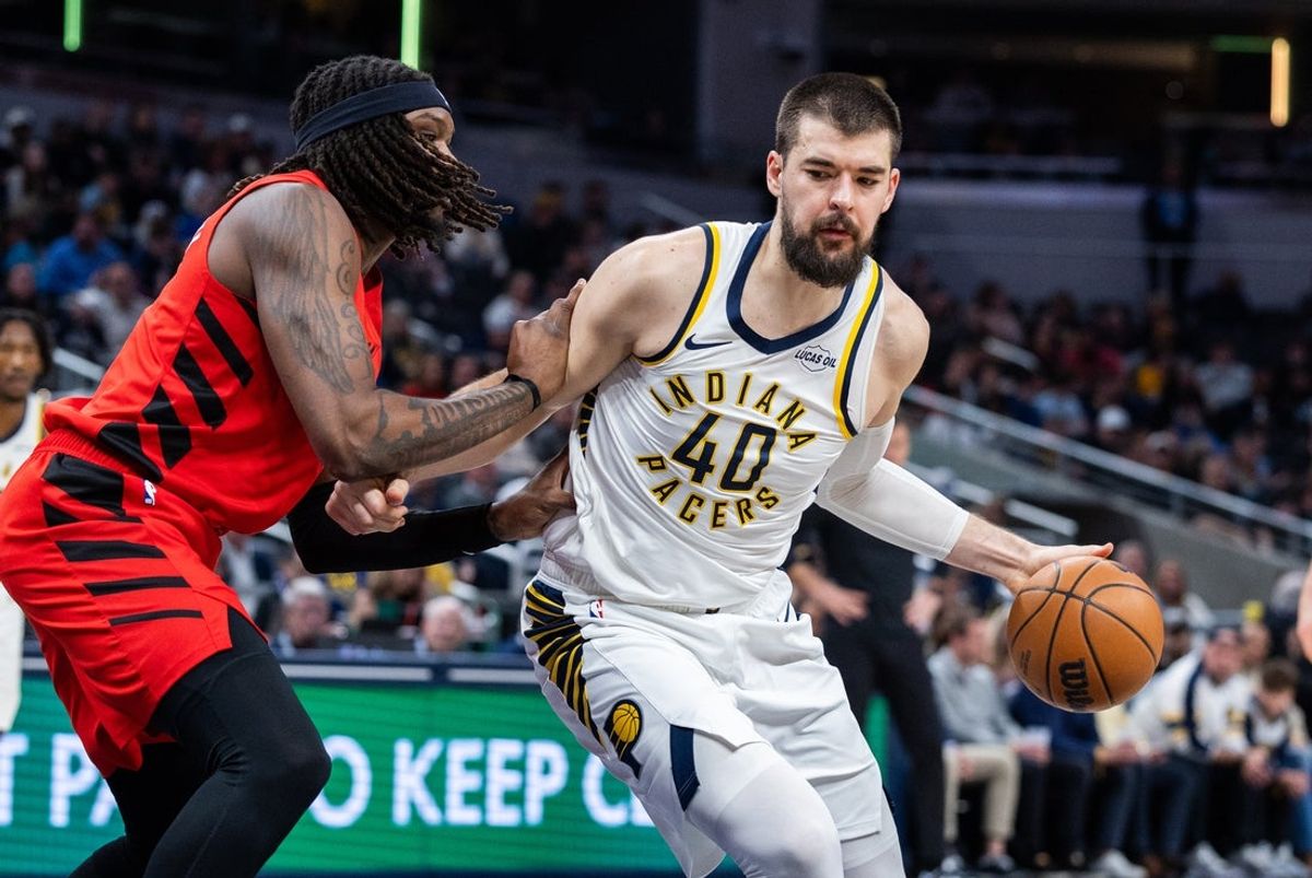 Mar 18, 2026; Indianapolis, Indiana, USA; Indiana Pacers center Ivica Zubac (40) dribbles the ball as Portland Trail Blazers center/forward Robert Williams III (35) defends in the first half at Gainbridge Fieldhouse. Mandatory Credit: Trevor Ruszkowski-Imagn Images