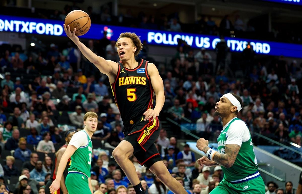 Mar 18, 2026; Dallas, Texas, USA; Atlanta Hawks guard Dyson Daniels (5) shoots past Dallas Mavericks forward P.J. Washington (25) during the second half at American Airlines Center. Mandatory Credit: Kevin Jairaj-Imagn Images