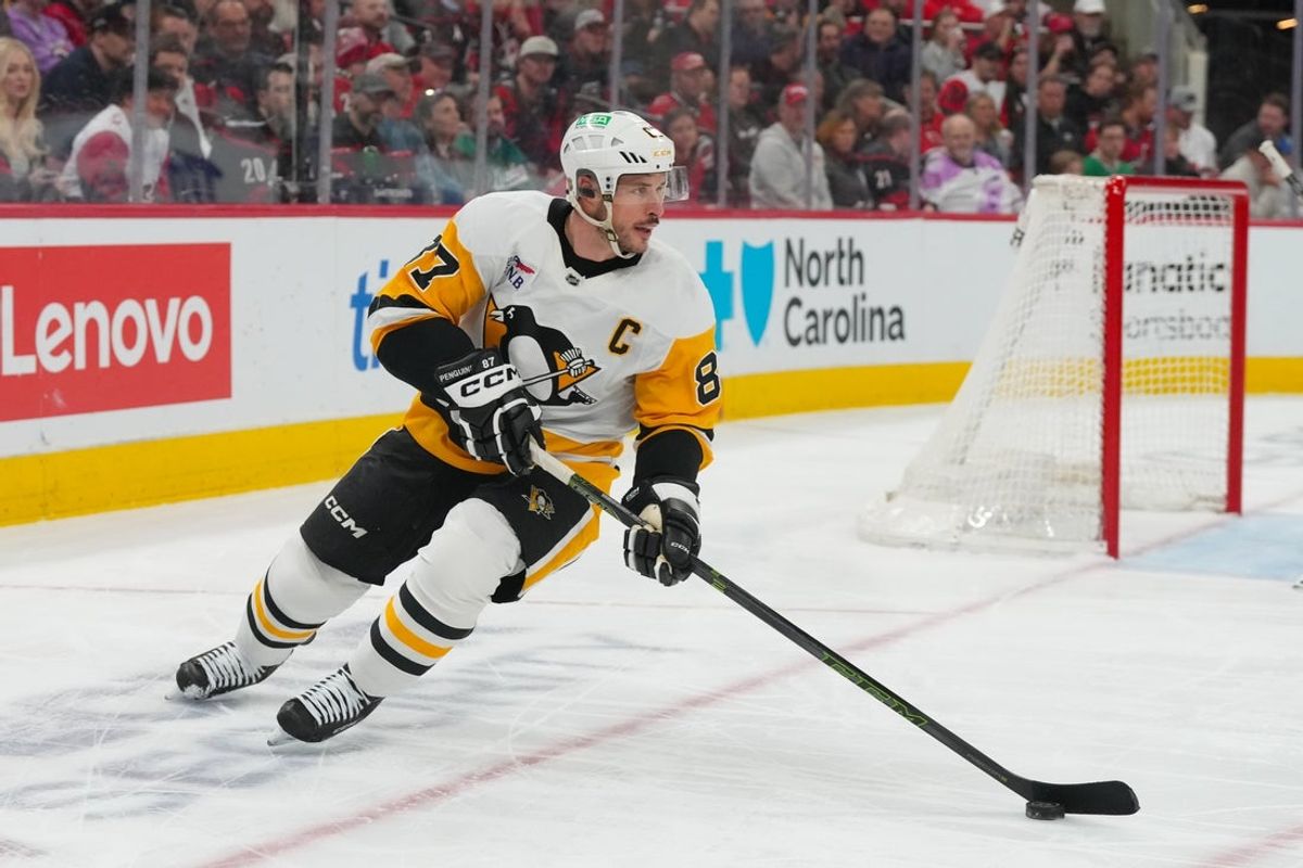 Mar 18, 2026; Raleigh, North Carolina, USA;  Pittsburgh Penguins center Sidney Crosby (87) skates with the puck against the Carolina Hurricanes during the first period at Lenovo Center. Mandatory Credit: James Guillory-Imagn Images