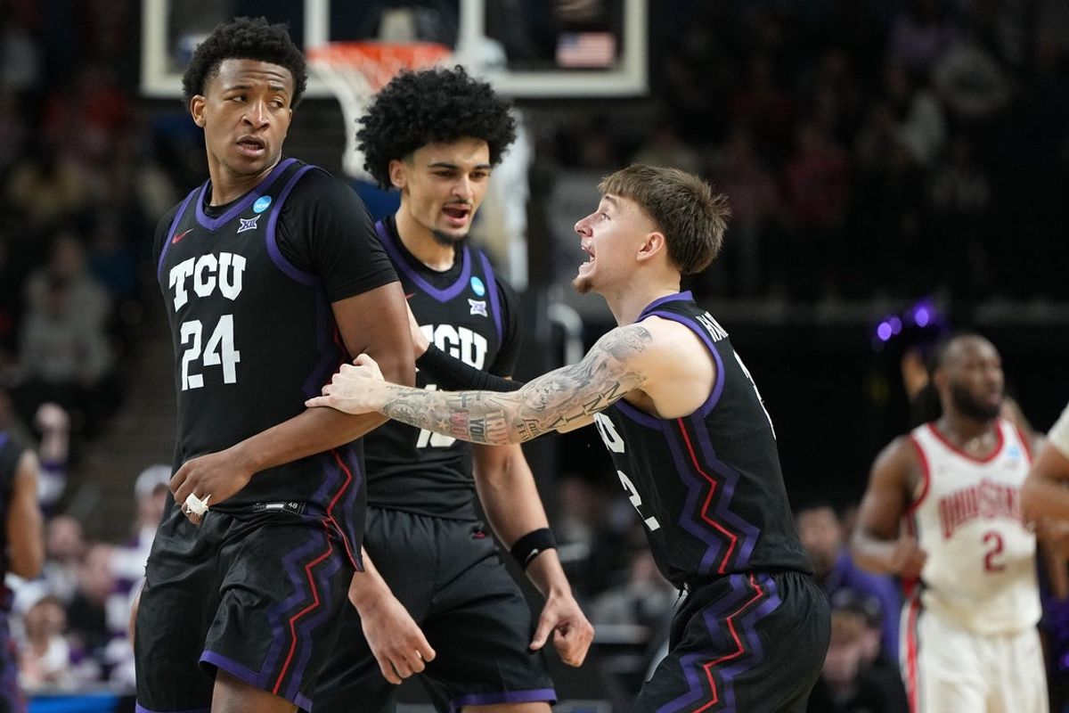 Mar 19, 2026; Greenville, SC, USA; Texas Christian University Horned Frogs forward Xavier Edmonds (24) reacts with guard Brock Harding (2) in the second half during a first round game of the men's 2026 NCAA Tournament at Bon Secours Wellness Arena. Mandatory Credit: Bob Donnan-Imagn Images
