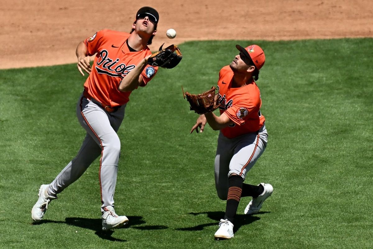 Mar 19, 2026; Tampa, Florida, USA; Baltimore Orioles starting pitcher Dean Kremer (64) looks on as third baseman Coby Mayo (16) catches a pop up in the third inning against the New York Yankees during spring training at George M. Steinbrenner Field. Mandatory Credit: Jonathan Dyer-Imagn Images