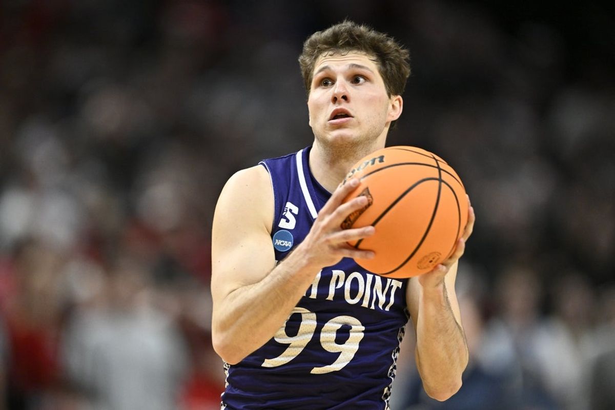 Mar 19, 2026; Portland, OR, USA; High Point Panthers guard Chase Johnston (99) controls the ball against the Wisconsin Badgers during the second half of a first round game of the men's 2026 NCAA Tournament at Moda Center. Mandatory Credit: Craig Strobeck-Imagn Images