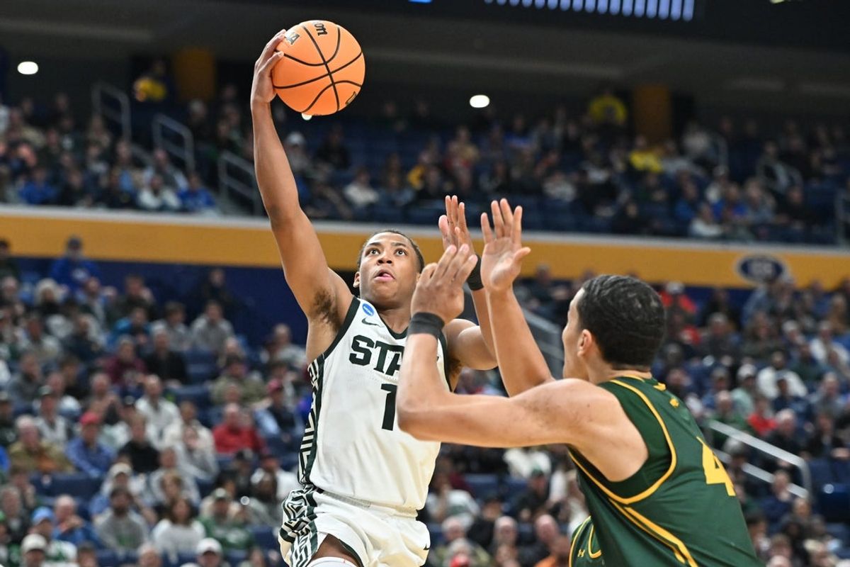 Mar 19, 2026; Buffalo, NY, USA; Michigan State Spartans guard Jeremy Fears Jr. (1) drives to the basket for a lay up as North Dakota State Bison forward Treyson Anderson (44) defends during the second half during a first round game of the men's 2026 NCAA Tournament at Keybank Center. Mandatory Credit: Mark Konezny-Imagn Images