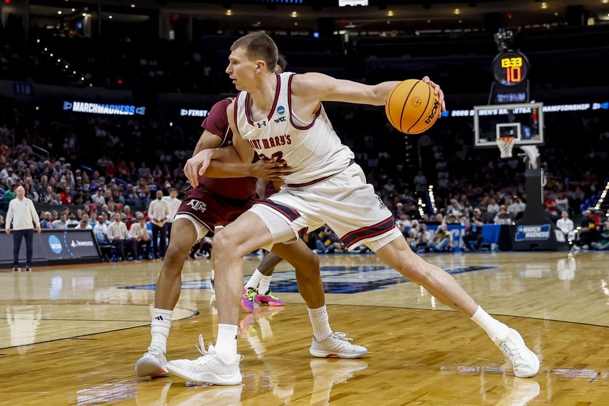 Mar 19, 2026; Oklahoma City, OK, USA; Saint Mary's (CA) Gaels forward Paulius Murauskas (23) dribbles the ball during a first round game of the men's 2026 NCAA Tournament at Paycom Center. Mandatory Credit: Alonzo Adams-Imagn Images