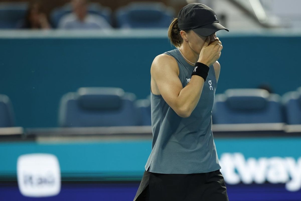 Mar 19, 2026; Miami Gardens, FL, USA; Iga Swiatek (POL) reacts after missing a shot against Magda Linette (POL) (not pictured) on day three of the 2026 Miami Open at Hard Rock Stadium. Mandatory Credit: Geoff Burke-Imagn Images