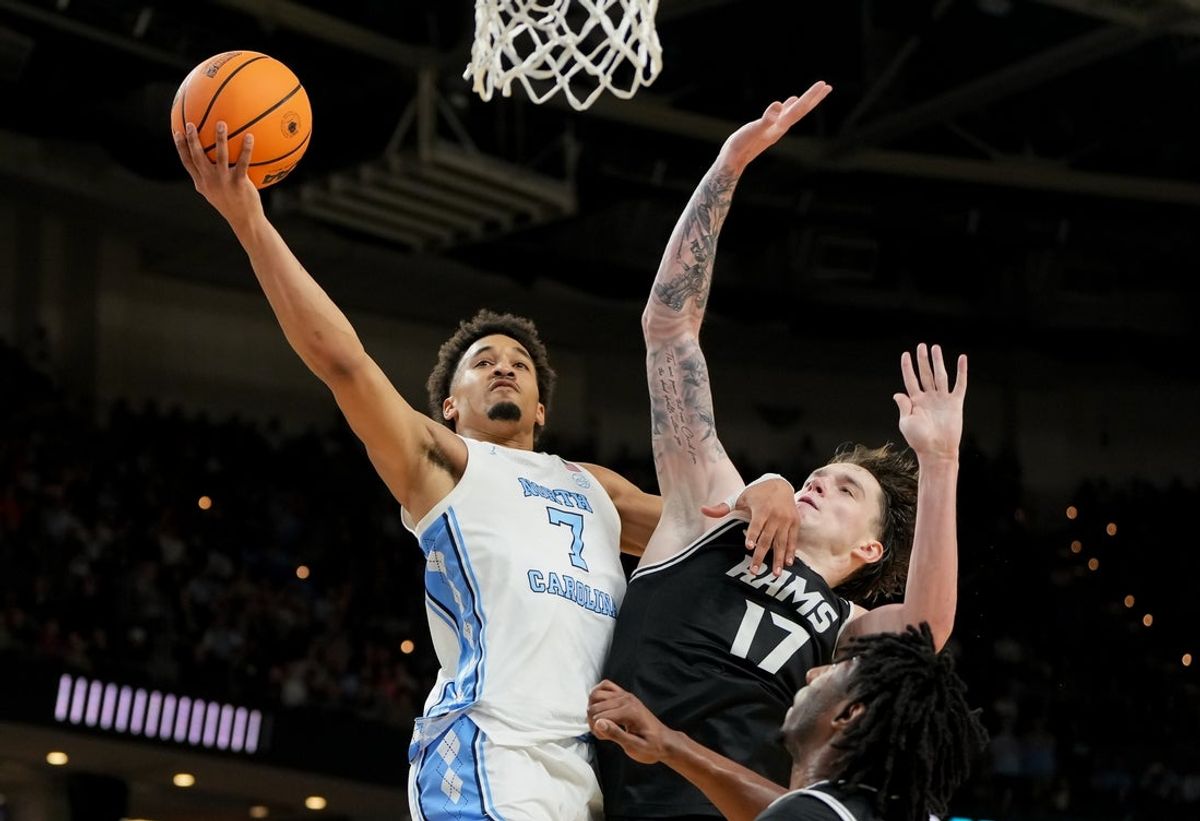 Mar 19, 2026; Greenville, SC, USA; North Carolina Tar Heels guard Seth Trimble (7) goes to the basket against VCU Rams forward Lazar Djokovic (17) in the second half of a first round game of the men's 2026 NCAA Tournament at Bon Secours Wellness Arena. Mandatory Credit: Bob Donnan-Imagn Images