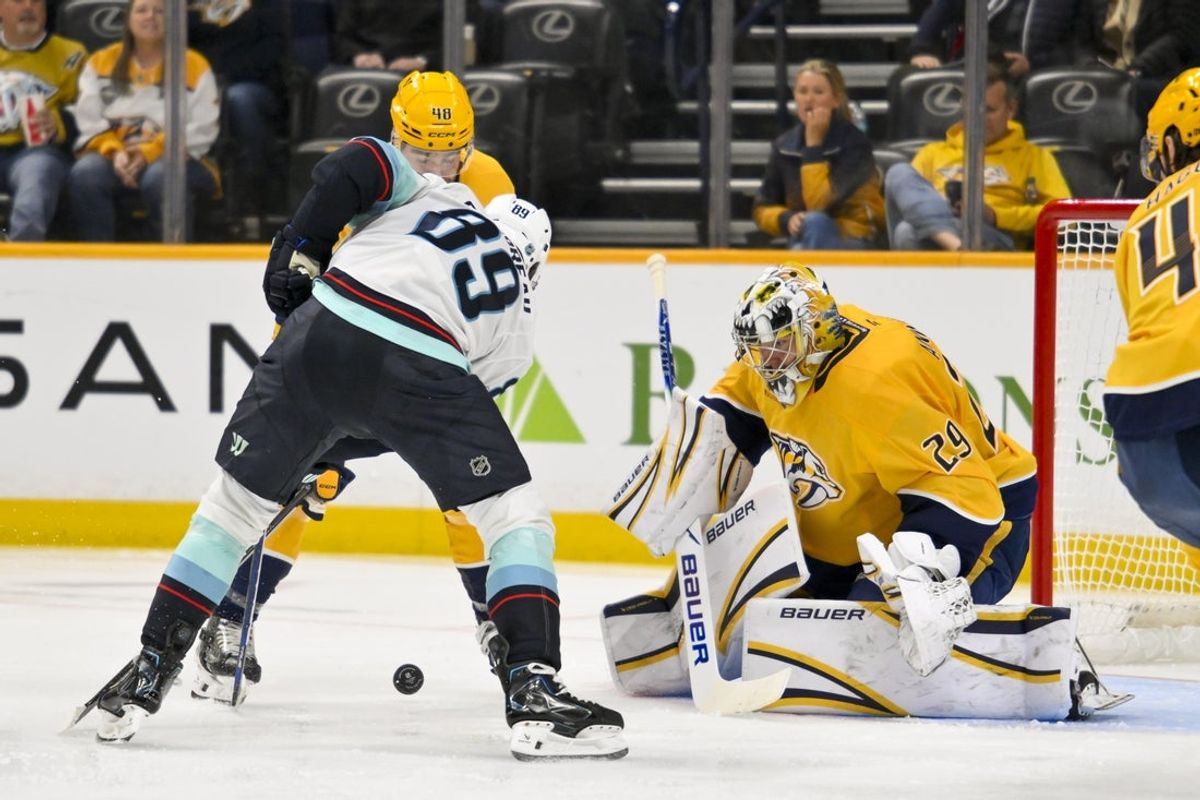 Mar 19, 2026; Nashville, Tennessee, USA;  Nashville Predators goaltender Justus Annunen (29) blocks the shot of Seattle Kraken center Frederick Gaudreau (89) during the second period at Bridgestone Arena. Mandatory Credit: Steve Roberts-Imagn Images
