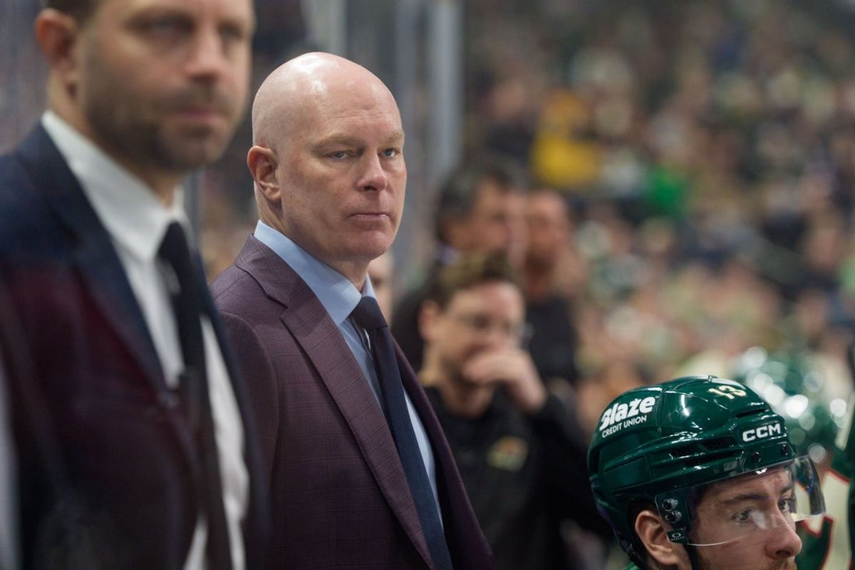 Mar 19, 2026; Saint Paul, Minnesota, USA; Minnesota Wild head coach John Hynes looks on behind the bench in the third period against the Chicago Blackhawks at Grand Casino Arena. Mandatory Credit: Matt Blewett-Imagn Images
