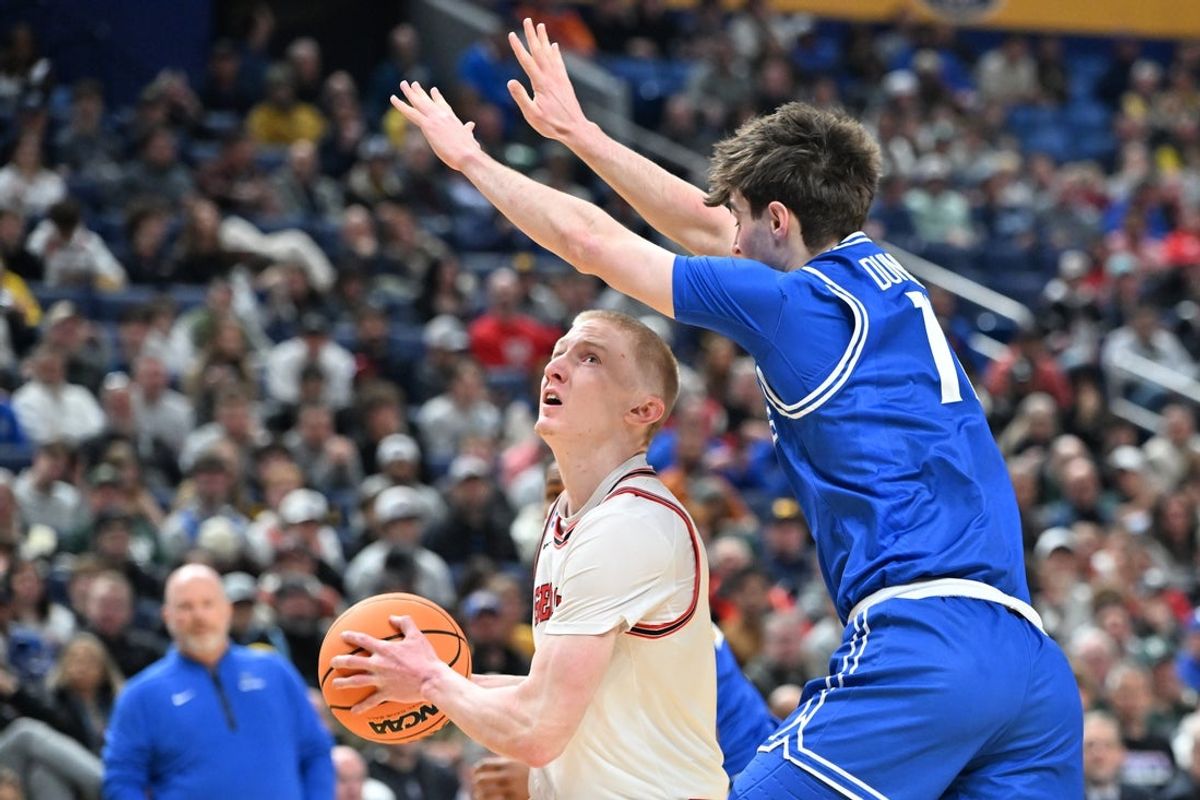 Mar 19, 2026; Buffalo, NY, USA; Georgia Bulldogs guard Blue Cain (0) looks to shoot the ball against Saint Louis Billikens forward Brady Dunlap (11) during the first half of a first round game of the men's 2026 NCAA Tournament at Keybank Center. Mandatory Credit: Mark Konezny-Imagn Images